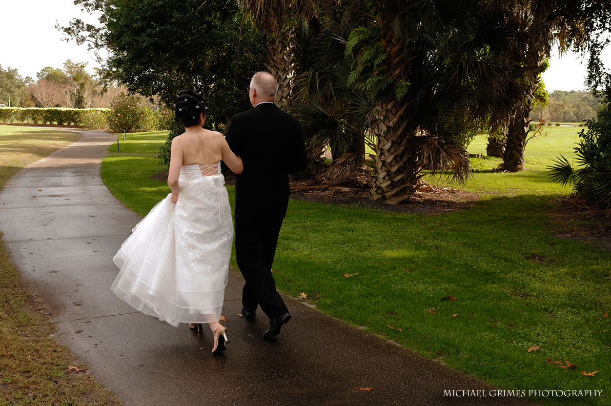 bride and groom walking together away from the camera